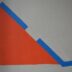 a drawing of a triangle on a white wall