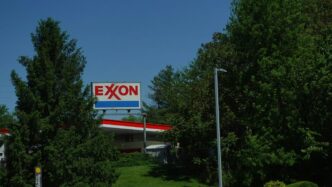 Exxon gas station with trees and blue sky