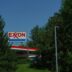 Exxon gas station with trees and blue sky