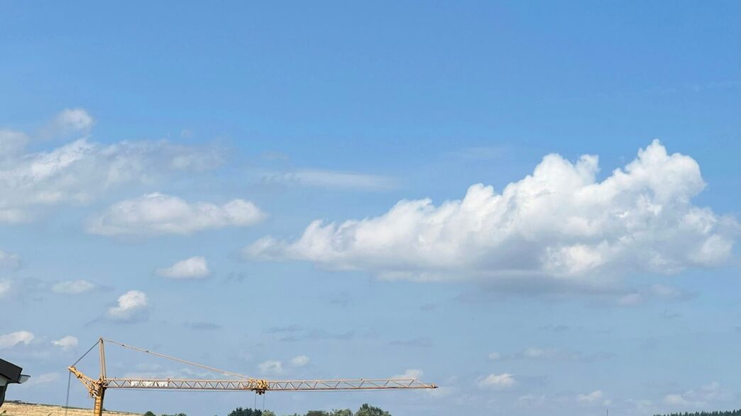 a crane that is standing in the sky