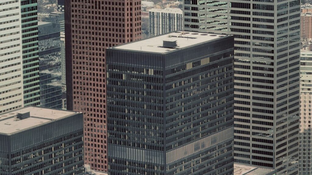 a view of some very tall buildings in a big city