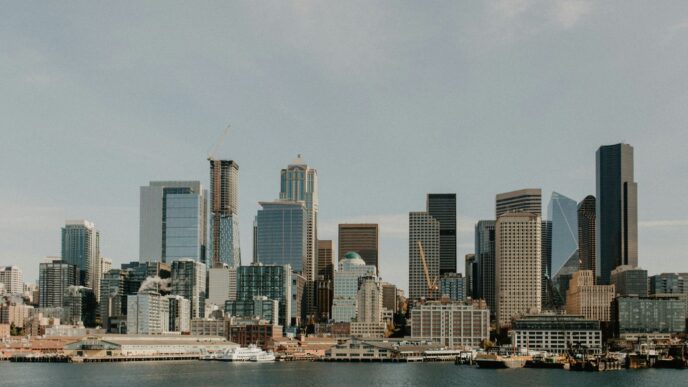 city skyline across body of water during daytime