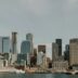 city skyline across body of water during daytime