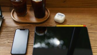 a tablet and a glass of beer