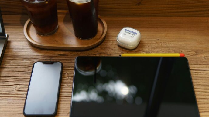 a tablet and a glass of beer
