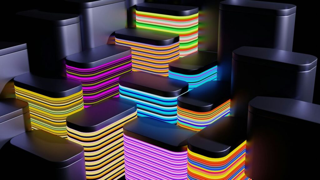 A bunch of different colored stacks of cell phones