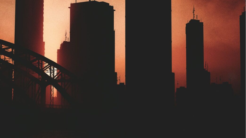 a picture of a city skyline with a bridge in the foreground