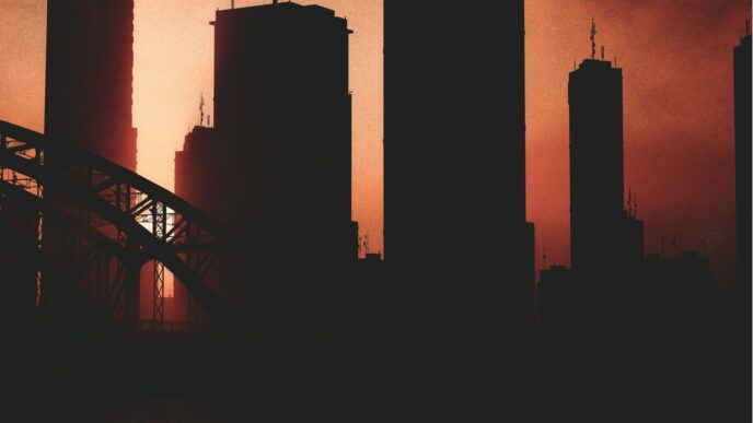 a picture of a city skyline with a bridge in the foreground