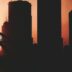 a picture of a city skyline with a bridge in the foreground