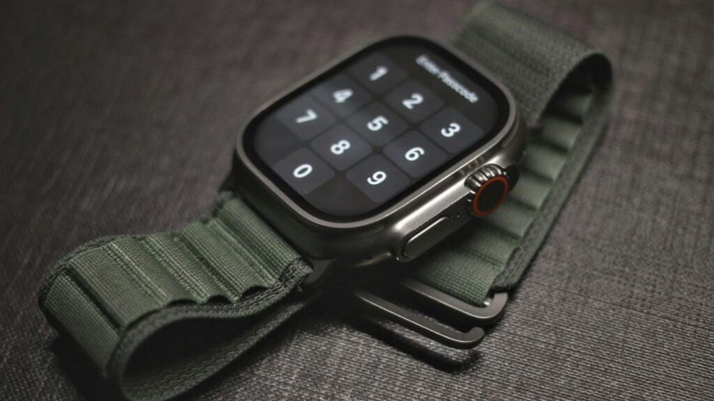 an apple watch with a green strap