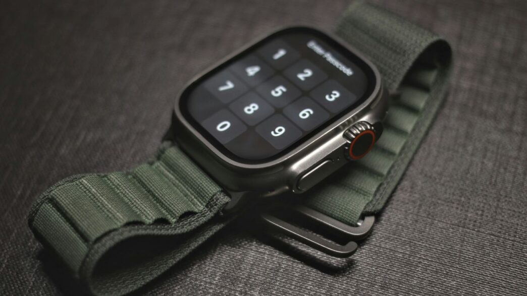 an apple watch with a green strap