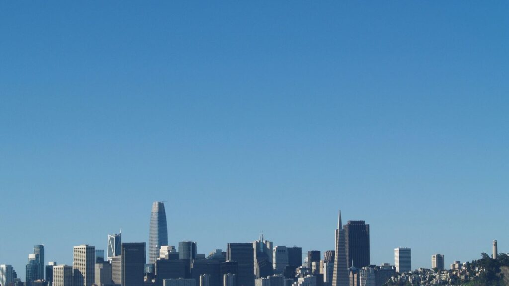city skyline under blue sky during daytime