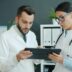 Two doctors looking at a tablet together
