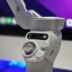 A close up of a video game controller in front of a computer