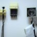a white wall with a bunch of electrical equipment on it
