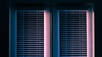 white window blinds closed