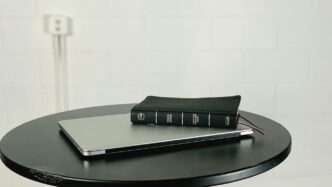black and gray laptop computer on black wooden table