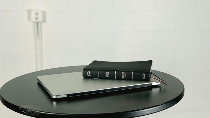 black and gray laptop computer on black wooden table