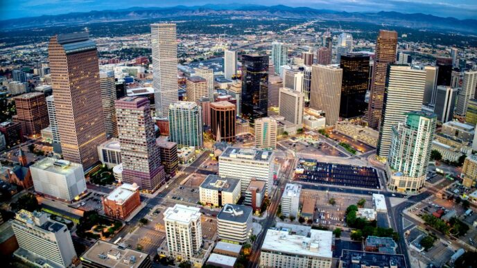 an aerial view of a city with tall buildings