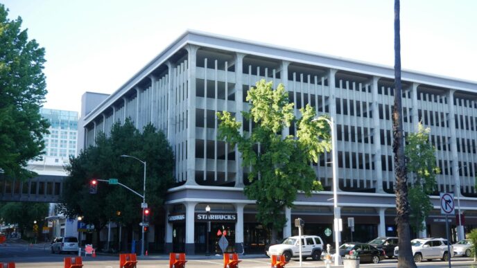 a large white building sitting on the side of a road
