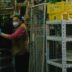 a woman wearing a face mask and gloves in a store