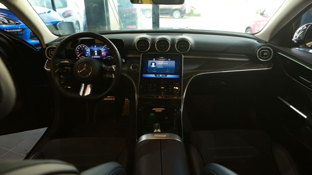 the interior of a car with a dash board and steering wheel