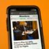black samsung android smartphone on orange table