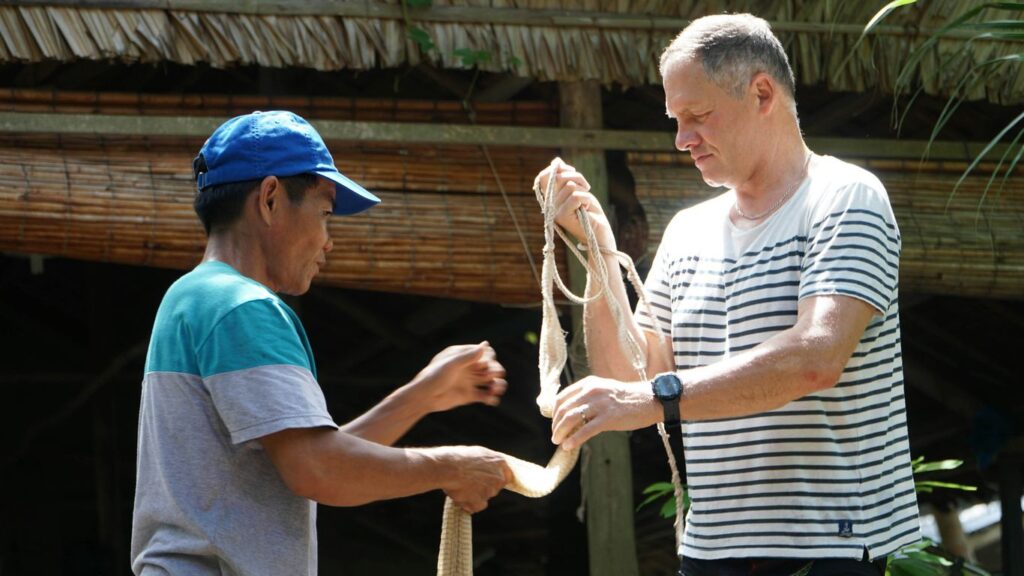 a man shaking hands with another man