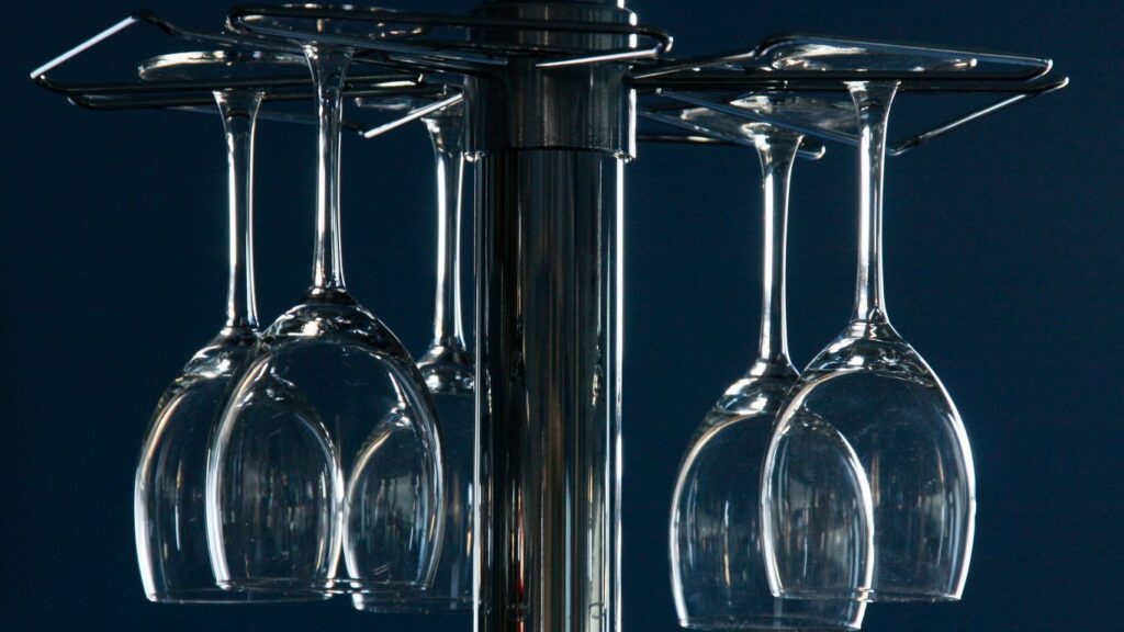 clear wine glasses on black table