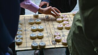 person playing board game