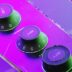 Three green knobs on a control panel