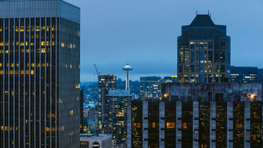 a view of a city at night from the top of a building