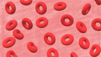 a bunch of red donuts floating in the air