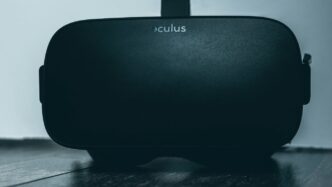 black jbl portable speaker on black table