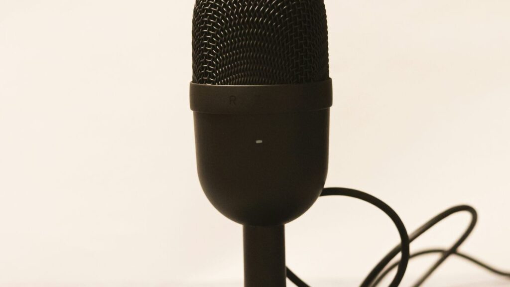 a microphone is plugged into a charger