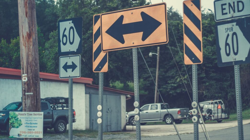 a street sign is posted on a pole