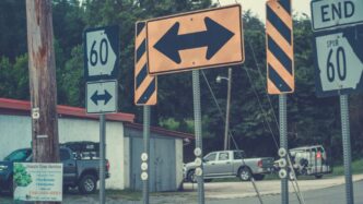 a street sign is posted on a pole