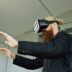 Man wearing vr headset with hands outstretched