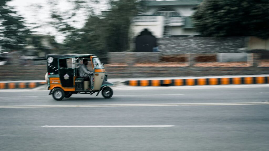 a person driving a small vehicle