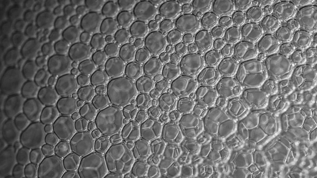a close up of water droplets on a glass surface
