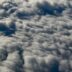 Fluffy white clouds seen from above.