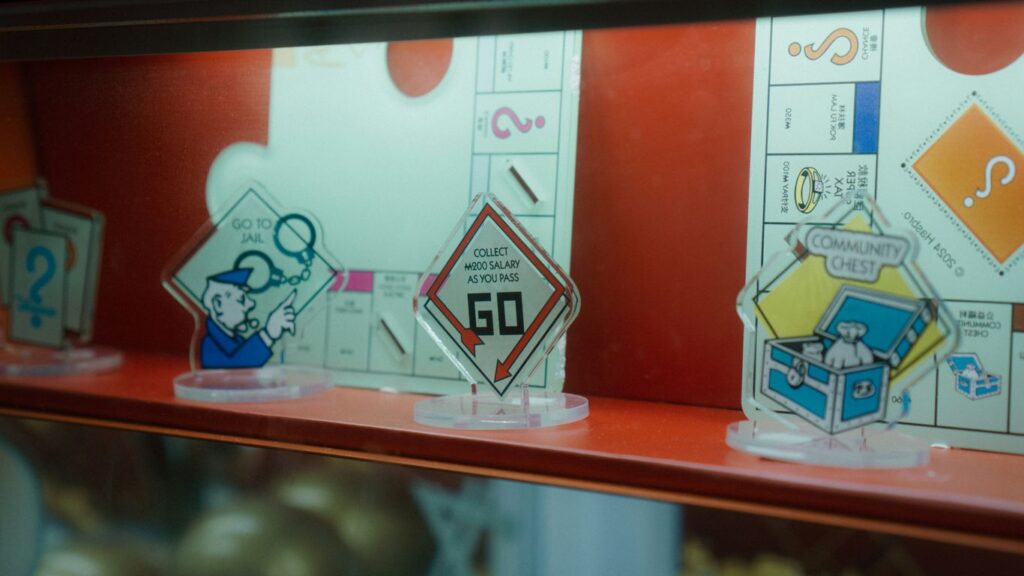 Monopoly game pieces on a shelf