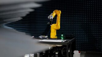 a yellow robot sitting on top of a table