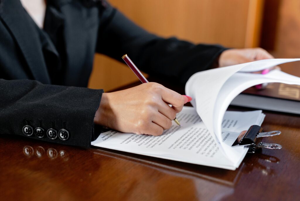 lawyer signing documents