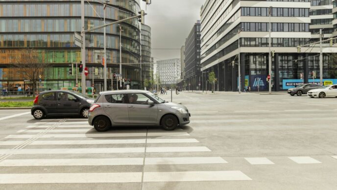 A couple of cars that are sitting in the street