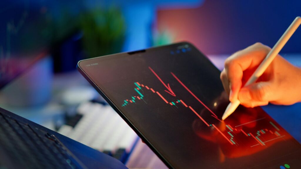 Someone is analyzing a stock market graph.