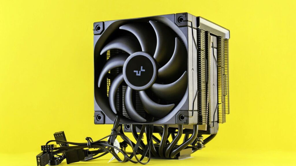 Computer cpu cooler with fan on yellow background