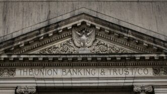 brown concrete building with statue