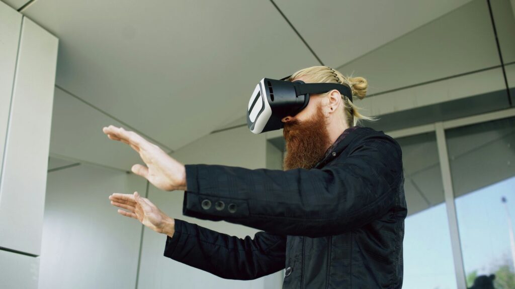Man wearing vr headset with hands outstretched