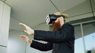 Man wearing vr headset with hands outstretched